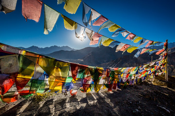 Colourful Buddhist prayer flags near Lamayuru monastery in the Himalayan mountain, Ladakh, India - obrazy, fototapety, plakaty