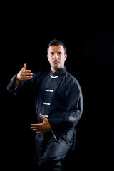 Man exercise Tai Chi indoor.