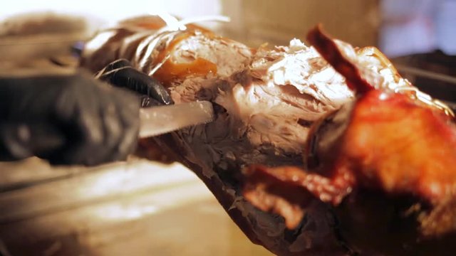 cut the suckling pig on a spit.