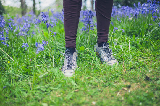 Feet of woman standing in meadow