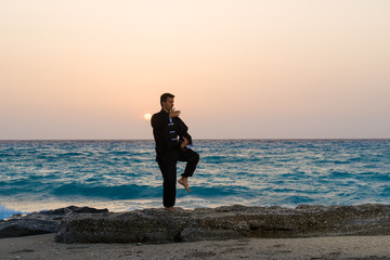 Fototapeta premium man performs tai chi moves