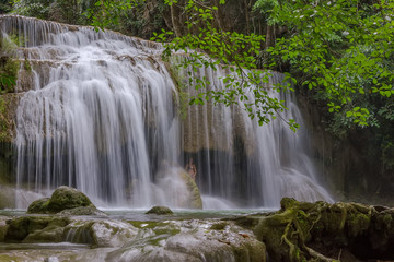 Fototapeta na wymiar Erawan waterfall in deep forest at Kanchanaburi Province, Thailand