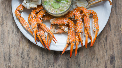 Crabs in a white dish. © suthicha
