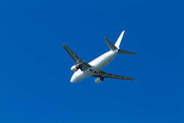  flying airplane on a clear sunny day
