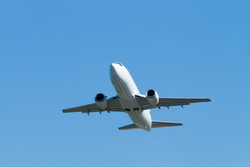 Fototapeta na wymiar flying airplane on a clear sunny day