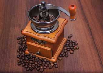 Coffee beans in a coffee grinder on a tree