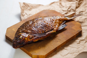 Smoked fish on the wood cutting board