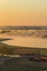 Beautiful foggy morning in a rural field