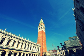 Fototapeta na wymiar San Marco Campanile and beautiful palace in Piazza San Marco, St Mark's Square, Venice, Italy