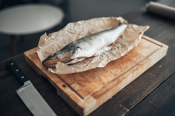 Fresh fish preparation on cutting board, closeup
