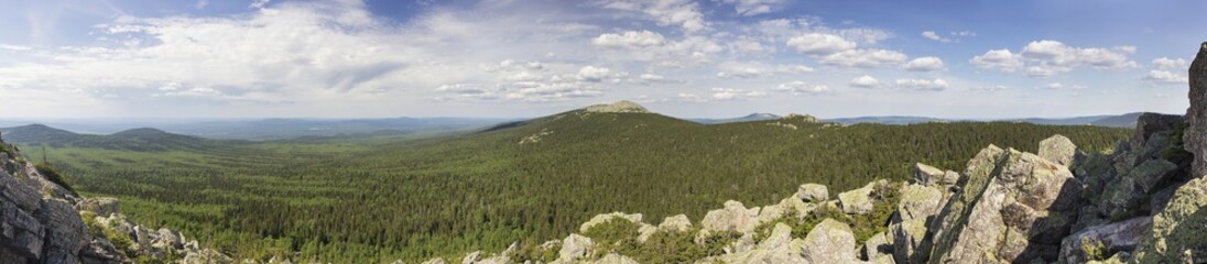 Fototapeta premium Panoramic view of the mountains and cliffs, South Ural. Summer in the mountains.View from the mountains.