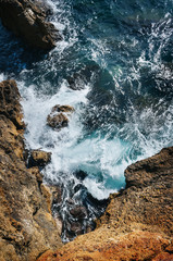 Beautiful cliffs, rocks at seashore, cyan sea. Nice travel poster, postcard, natural background.