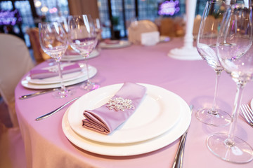 empty glasses and plates with forks