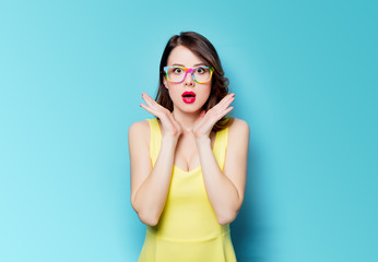 young surprised woman in glasses