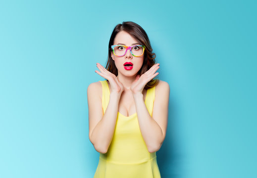 young surprised woman in glasses