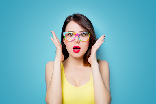 young surprised woman in glasses