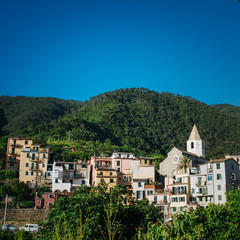 Fototapeta na wymiar Scenic view of Corniglia, small coastal village, Cinque Terre national park, La Spezia Region, Liguria, Italy. Beautiful travel destination square postcard.