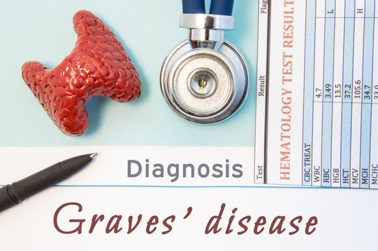 Endocrinology diagnosis Graves' disease. Figure of thyroid gland, result of laboratory analysis of blood medical stethoscope and black pen lying near text inscriptions Graves disease doctor workplace 