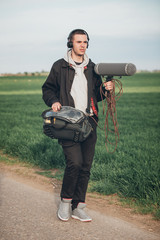 Behind the scene. Sound operator technician with boom microphone outdoor