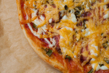 Close up of pizza on the cooking paper