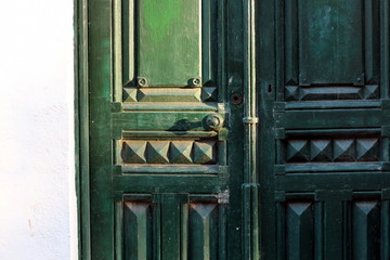 Vintage wooden tracery green door.