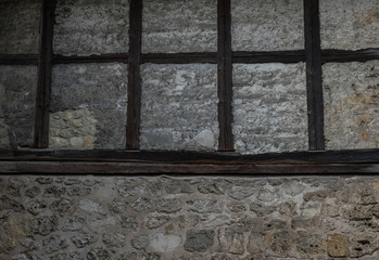 The old brick wall of half timbered house