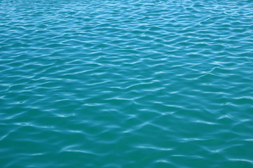 Blue sea surface with waves