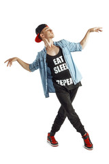 Full length portrait of an excited man dancing isolated on white background