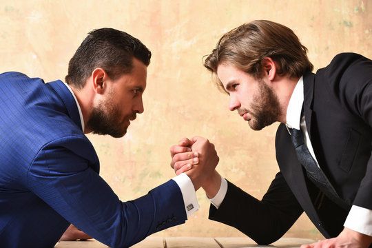 Conflict. Businessmen arm wrestling