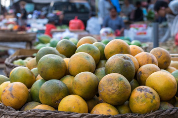 Fresh mandarin oranges on an organic food market of tropical Bali island, Indonesia. Mandarin background.