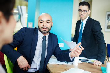 Media managers consulting about working moments