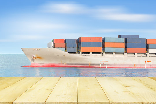 Cargo freight ship and cargo container in sea with blue sky for logistics and transportation background.