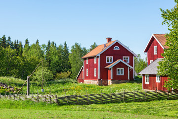 Red farm house in rural environment © Lars Johansson