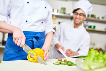 Trainee attending classes of cooking healthy food