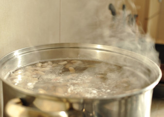 Steam over metal cooking pot