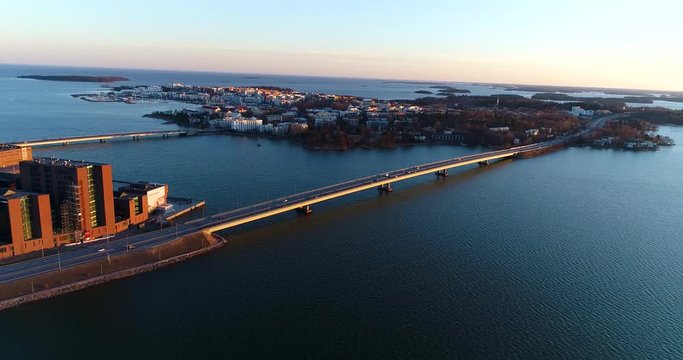 Lapinlahti bridge, Cinema 4k aerial pan view of cars driving on lapinlahden silta, on a sunny spring evening, in Ruoholahti, Helsinki, Finland