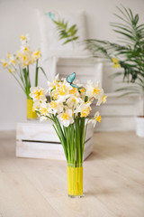 daffodils with butterflies, spring background of flowers.