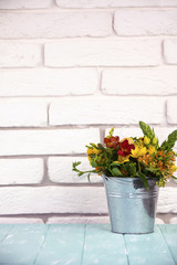 Fototapeta na wymiar bouquet of flowers in a bucket