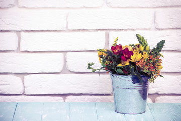 bouquet of flowers in a bucket