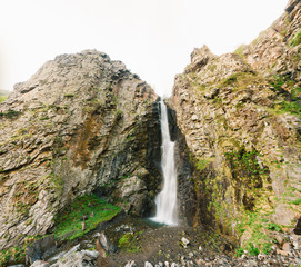 Fototapeta na wymiar Natural Landmark Gveleti Big Waterfalls In The Darial Gorge Dariali