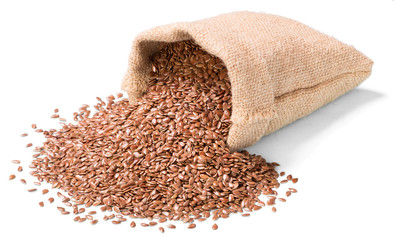 uncooked flax seeds on white, (large depth of field, taken with tilt shift lens)