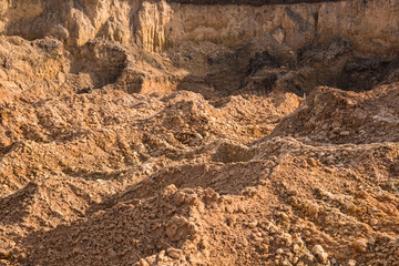 Clay and sand in the quarry. Beautiful unusual background similar to the surface of the planet Mars or the moon