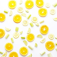 Fresh fruit in a cut on a white background. Pattern of citrus fruits. Food background. 