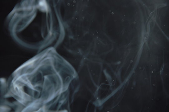 smoke floating without direction on black background