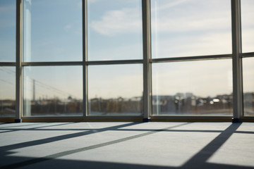 Naklejka na ściany i meble Part of modern office window with sunlight penetrating inside
