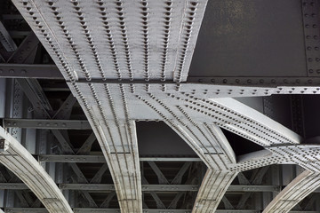 Urban view: small old bridges under modern automotive metal bridge