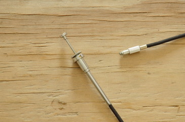 classic camera shutter cable released on wooden board