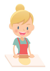 料理をする主婦　生地を伸ばす