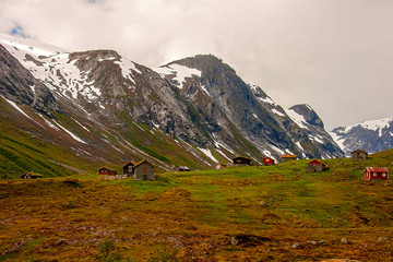 Traditional Norwegian house at the foot of the hill