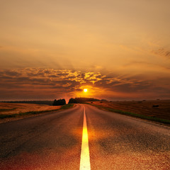 Morning sun over road leaving afar